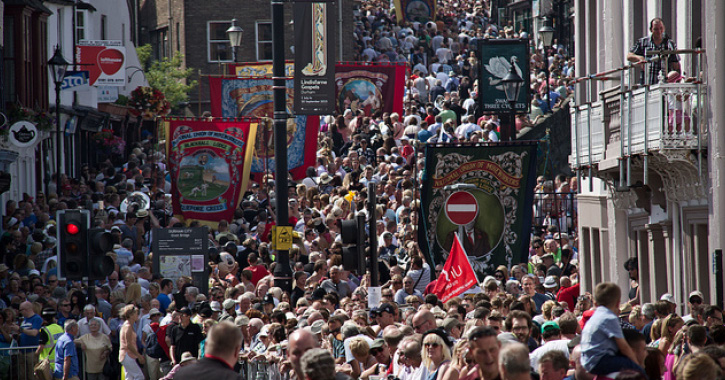 brass bands and people parade through streets of Durham City during the annual Durham Miners Gala